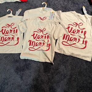 Four Christmas very meet white shirts with red lettering from Cat and Jack